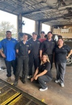Woodshore Family Dentistry team in auto shop