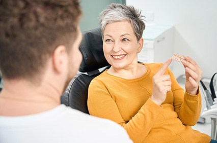 a woman during her dental implant consultation