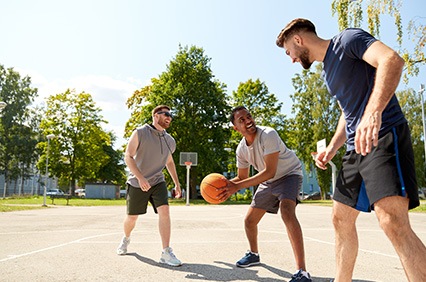 Group of friends playing basketball outside